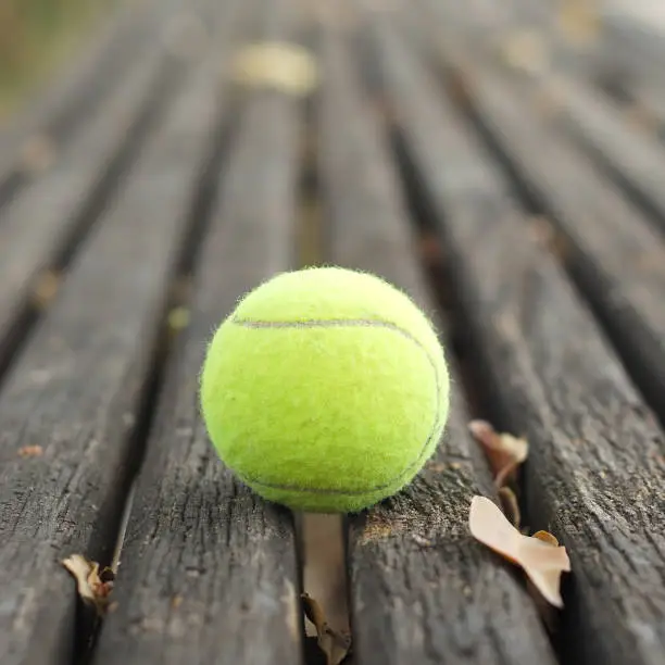 tennis balls on wood floor