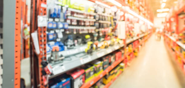 istock Blurred cordless kit and building material in home improvement store 902612358
