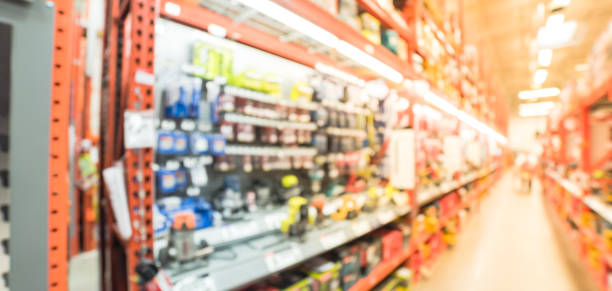 istock Blurred cordless kit and building material in home improvement store 902613068
