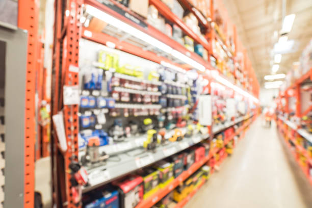 istock Blurred cordless kit and building material in home improvement store 902613346