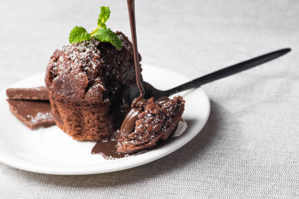 istock Sweet muffin cake with melted chocolate 902613586
