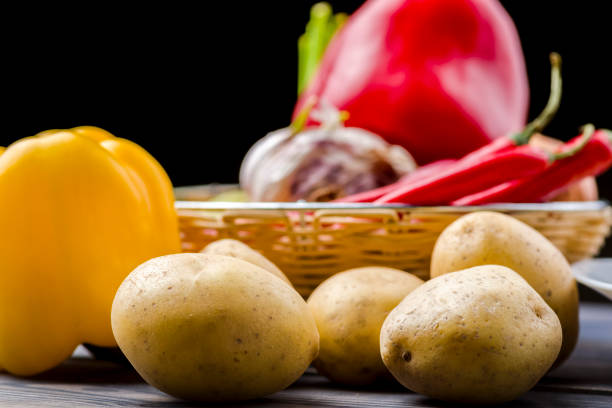 Basket with vegetables on a wooden stool