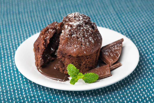 istock Sweet muffin cake with melted chocolate 902616484