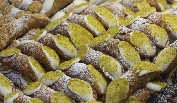 istock Sicilian cannoli stuffed with ricotta cheese and pistachios 902617078
