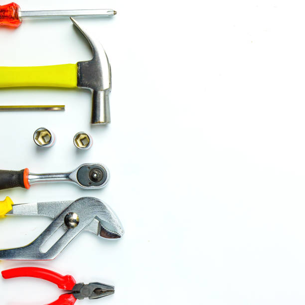 istock Top view of Working tools,wrench,socket wrench,hammer,screwdriver,plier,electric drill,tape measure,machinist square and safety glasses on white background.flat lay design for construction concept. 902620146