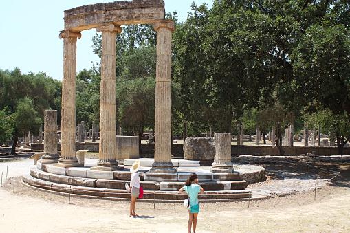 Tourists visiting Philippeion at ancient Olympia, Greece