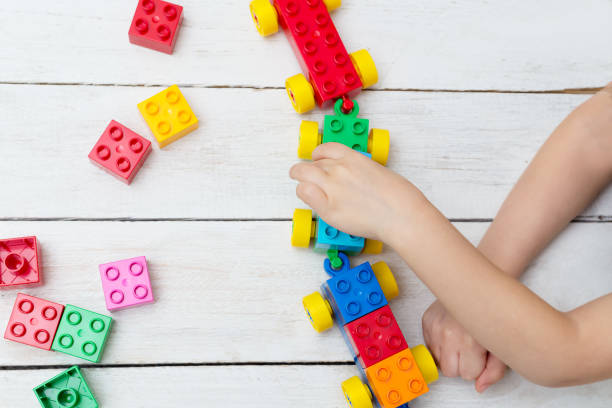 istock The boy is playing plastic block. Developing occupation for the child 902635844