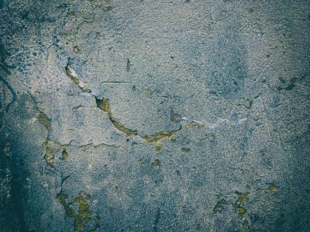 istock Grungy dark cement wall texture with scratches and crackes 902637520