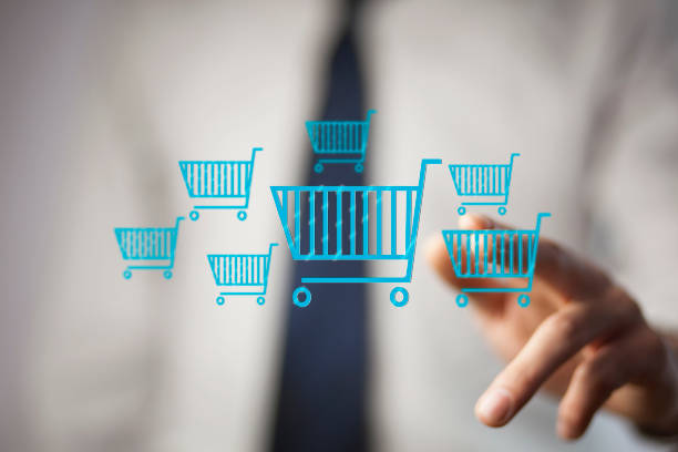 istock Businessman pressing shopping basket icon 902640070