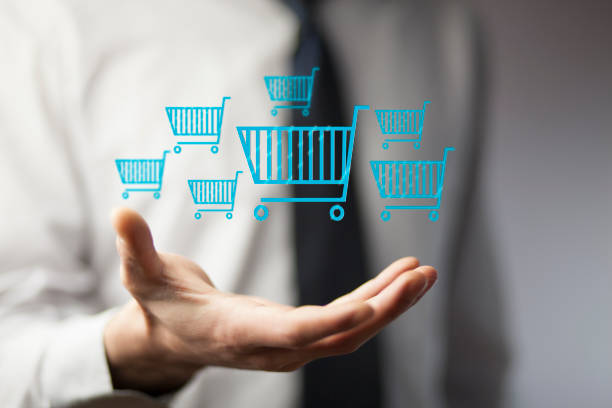istock Businessman pressing shopping basket icon 902640072
