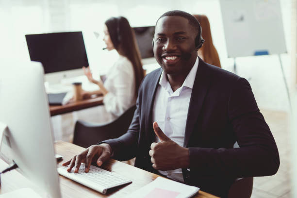 istock A black guy poses on the camera in the call center. 902646868