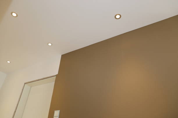 istock New renovated room with illuminated ceiling 902647298