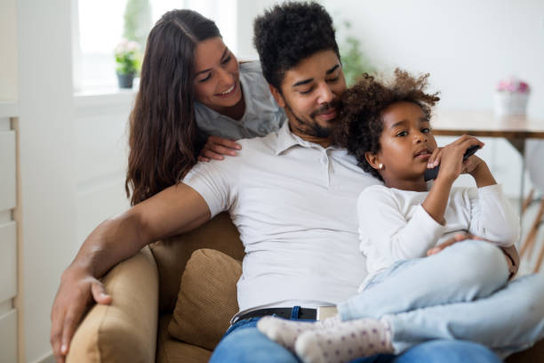 istock Young family being playful at home 902651908