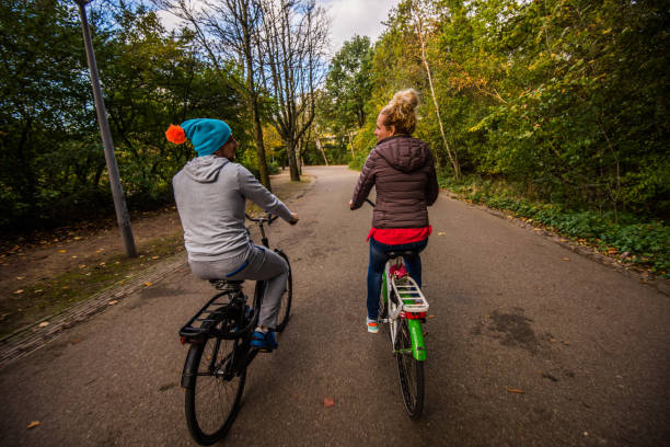 istock Family time riding bicycle at sunny autumn day. 902652098