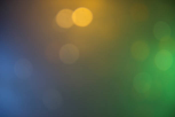 istock yellow, green, blue neon lights background 902655306