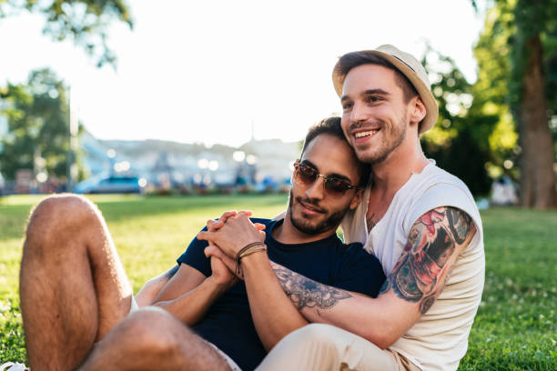istock Gay couple in park 902658316