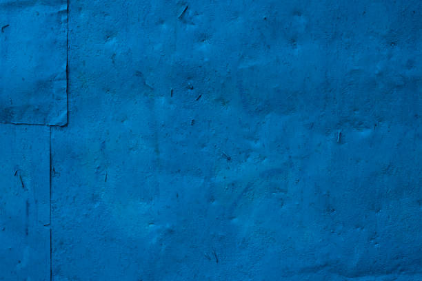 istock Old iron surface is painted with blue paint - bright rustic metal background 902670140