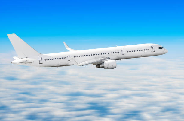 istock Airplane in the sky above the clouds flight journey sun height 902673416