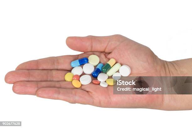 Senior Woman Holding Assorted Capsules In Her Hands Conceptual Of Health Care For The Elderly Stock Photo - Download Image Now