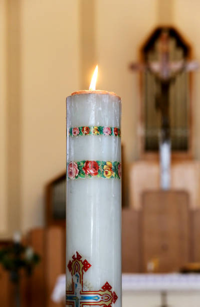big candle in the church during the holy mass