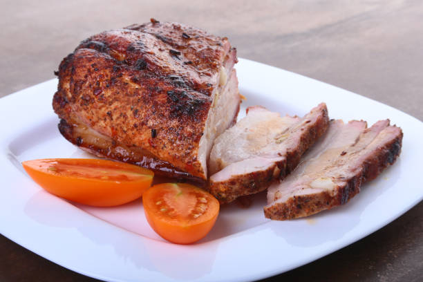istock grilled pork chops with tomato and ketchup on plate. 902681278