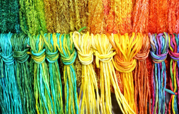 istock colorful threads of knotted and woven fabric 902681360