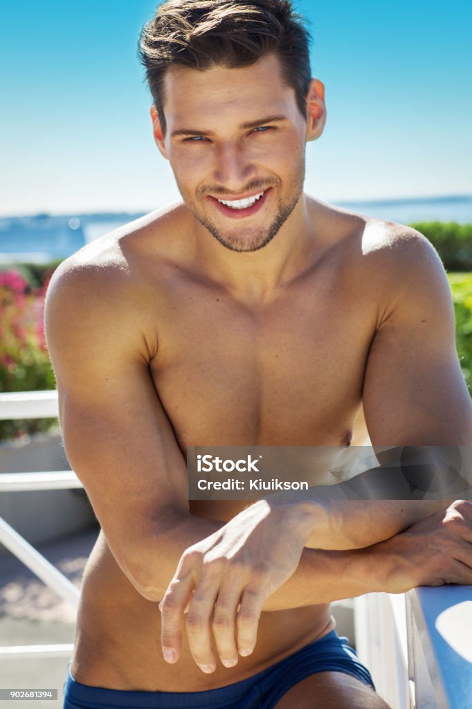 Handsome man Portrait of smiling man in summer scenery 20-29 Years Stock Photo