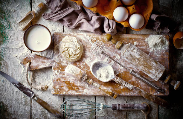 istock Dough with flour on an old background 902684456