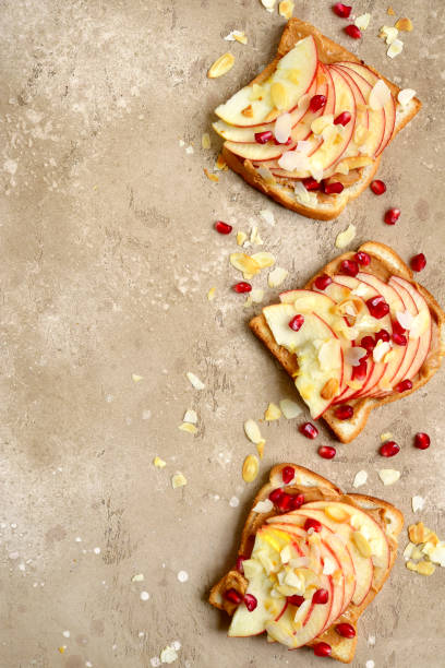 istock Toasts with peanut butter and apple slices 902684504