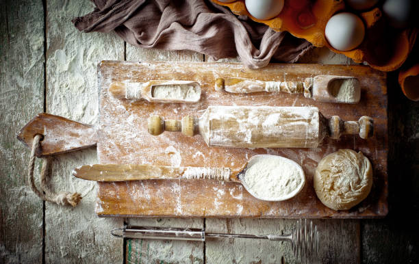 istock Dough with flour on an old background 902687172