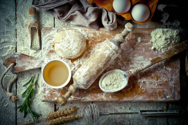 istock Dough with flour on an old background 902688060