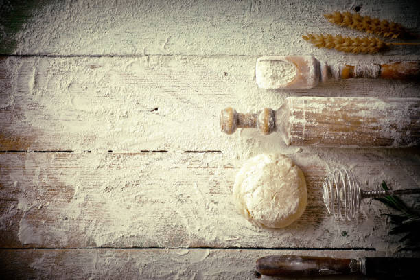 istock Dough with flour on an old background 902691040