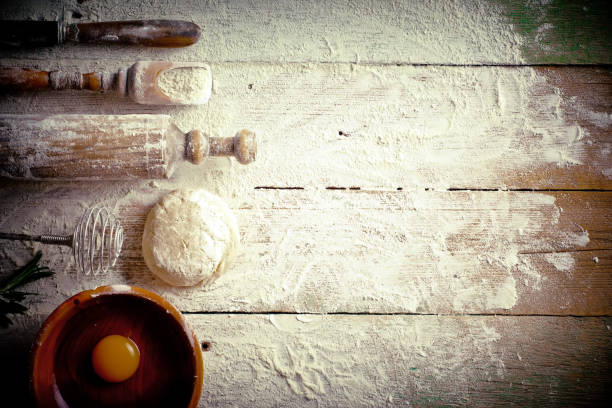 istock Dough with flour on an old background 902691124