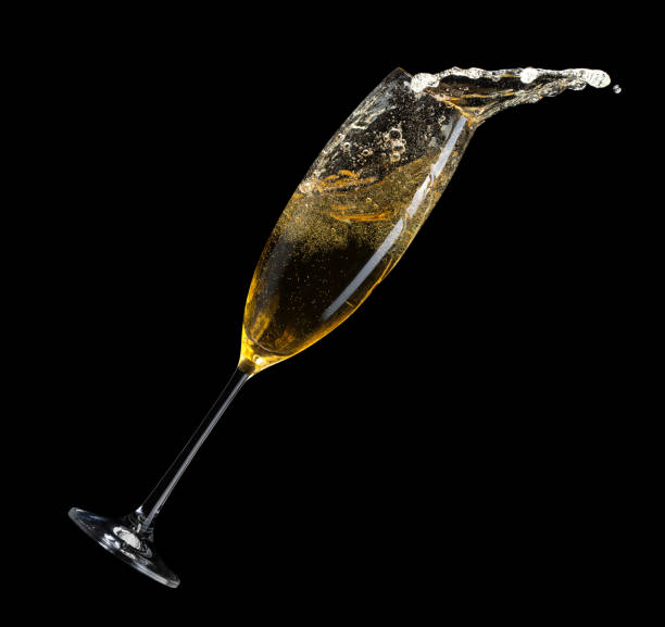 champagne splash from glass on a black background