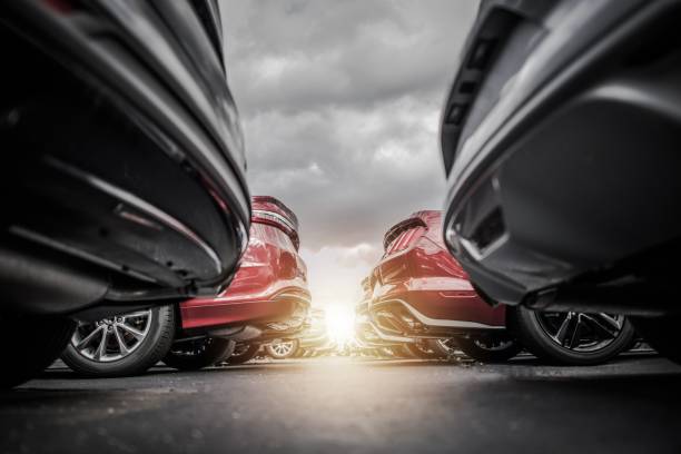 Car Dealership New and Pre Owned Vehicles Stock. Automotive Industry Concept Photo