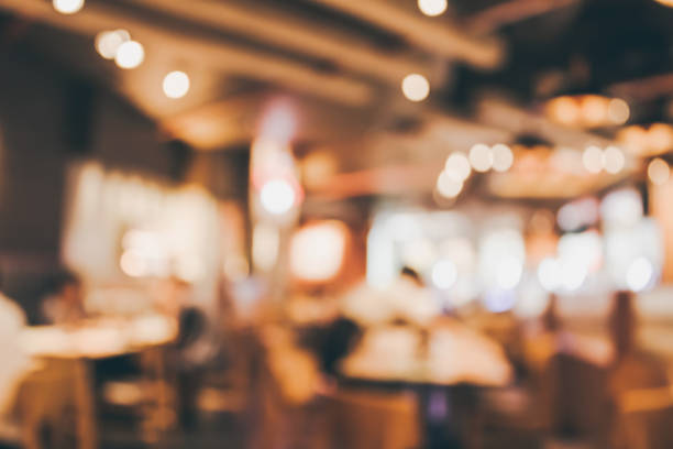 istock Restaurant cafe or coffee shop interior with people abstract blur background 902712596