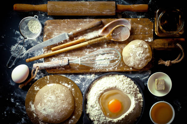 istock Dough and flour on an old background 902716654