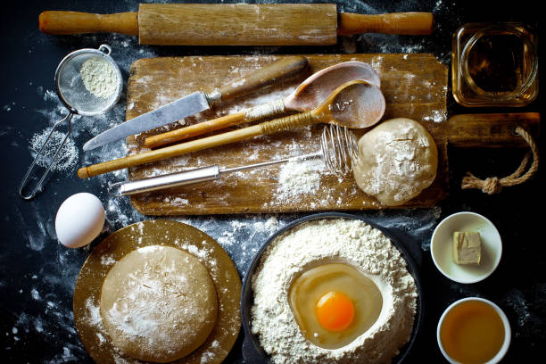 istock Dough and flour on an old background 902716692