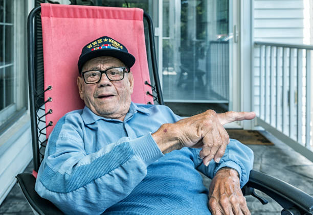 istock WWII and Korean Conflict Elderly Military Veteran Pointing Sideways 902719944