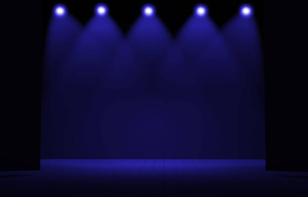 istock Stage lights ,free stage,concerrt stage .Several projectors on the ceiling. Spotlight strike through the darkness to the floor. 902720024