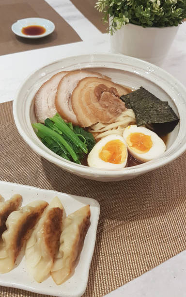 istock Janpanese noodle ramen with pork gyoza 902720234