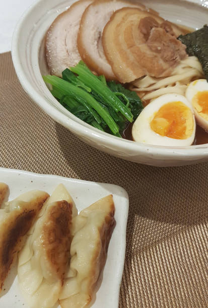 istock Janpanese noodle ramen with pork gyoza 902720238
