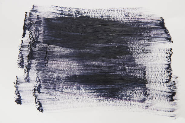 istock Black watercolor brush stroke over white background. 902725550