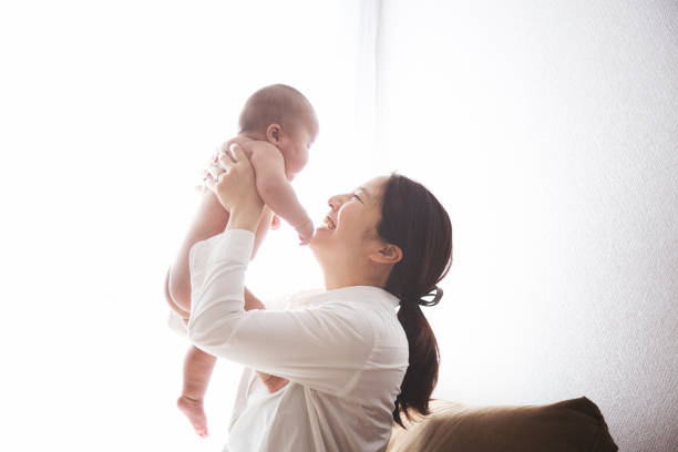 istock Mother and baby relaxed at home 902725898