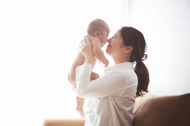 istock Mother and baby relaxed at home 902725916