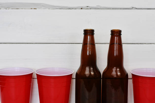 istock Red disposable Cups and Brown Beer Bottles 902726094