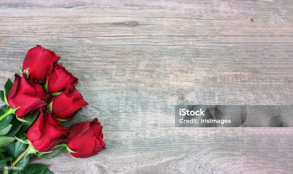 Valentine's Day Red Roses Over Wood Background Valentine's Day Red Roses Over Wood Background, Horizontal, Copy Space Rose - Flower Stock Photo