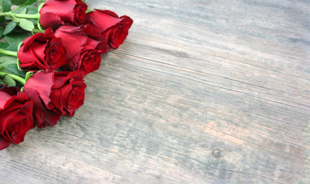 istock Valentine's Day Red Roses Over Wooden Background 902740170