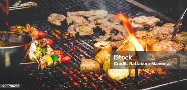 Mans Hand Cooking Grill Barbecue Steak With Fire Stock Photo - Download Image Now - Barbecue Grill, Barbecue - Meal, Barbecue - Social Gathering