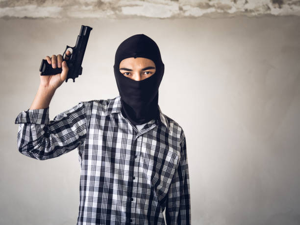 istock Portrait man holding gun, carbine and machine gun 902740424